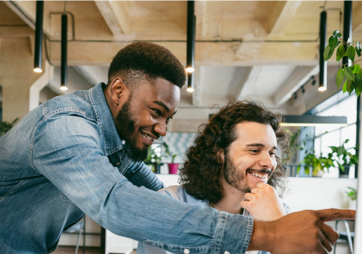 medium-shot-smiley-men-looking-computer 1
